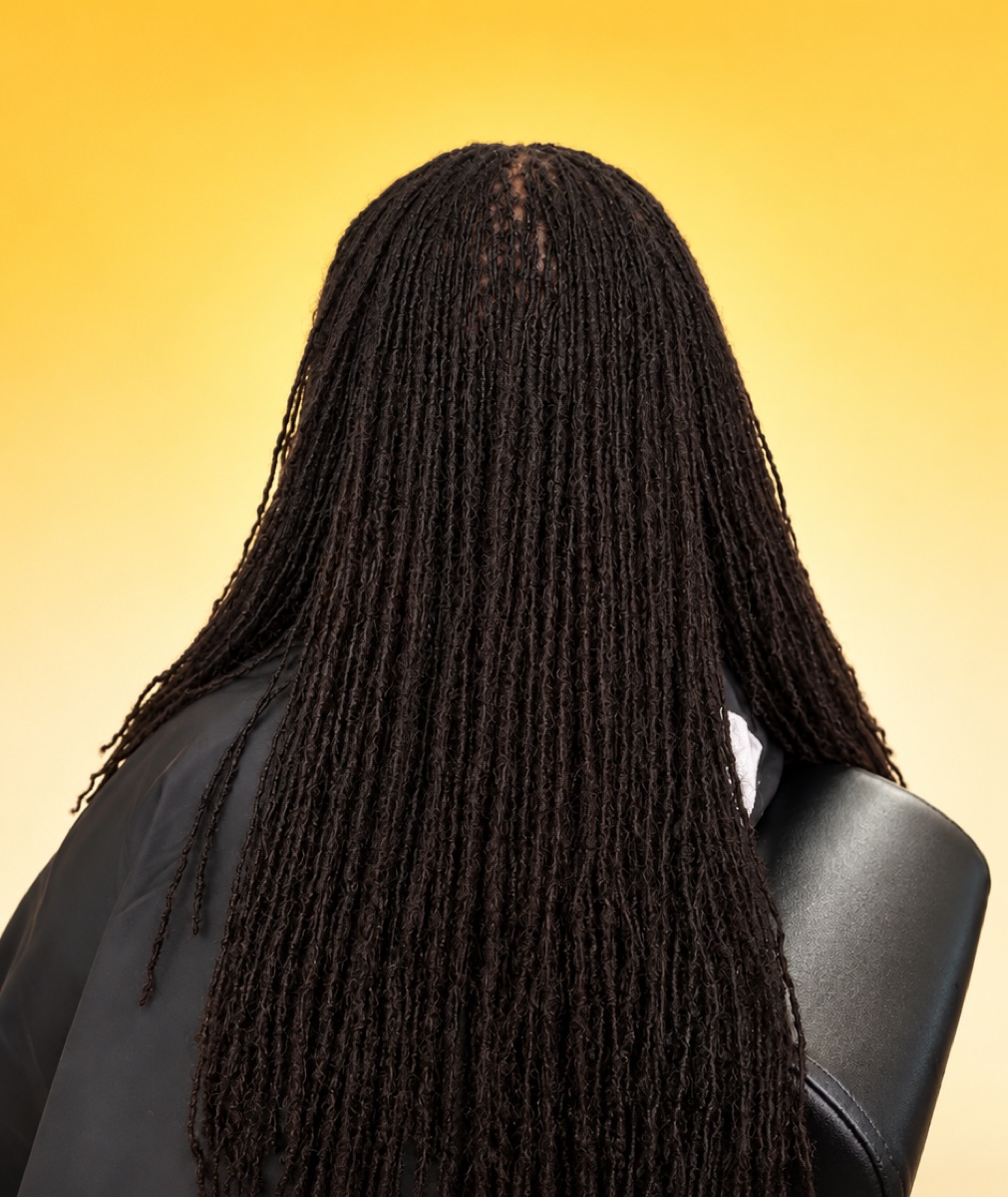 Long mature Sisterlocks on a sunflower-yellow backdrop