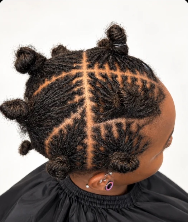 Sisterlocks styled in knots with geometric parts