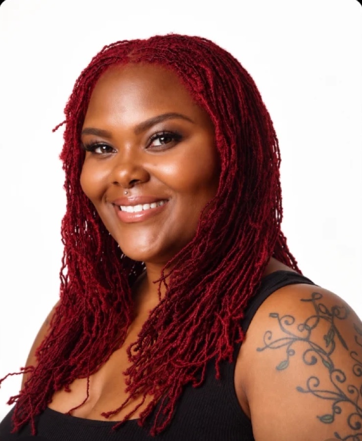 Smiling client with long red Sisterlocks